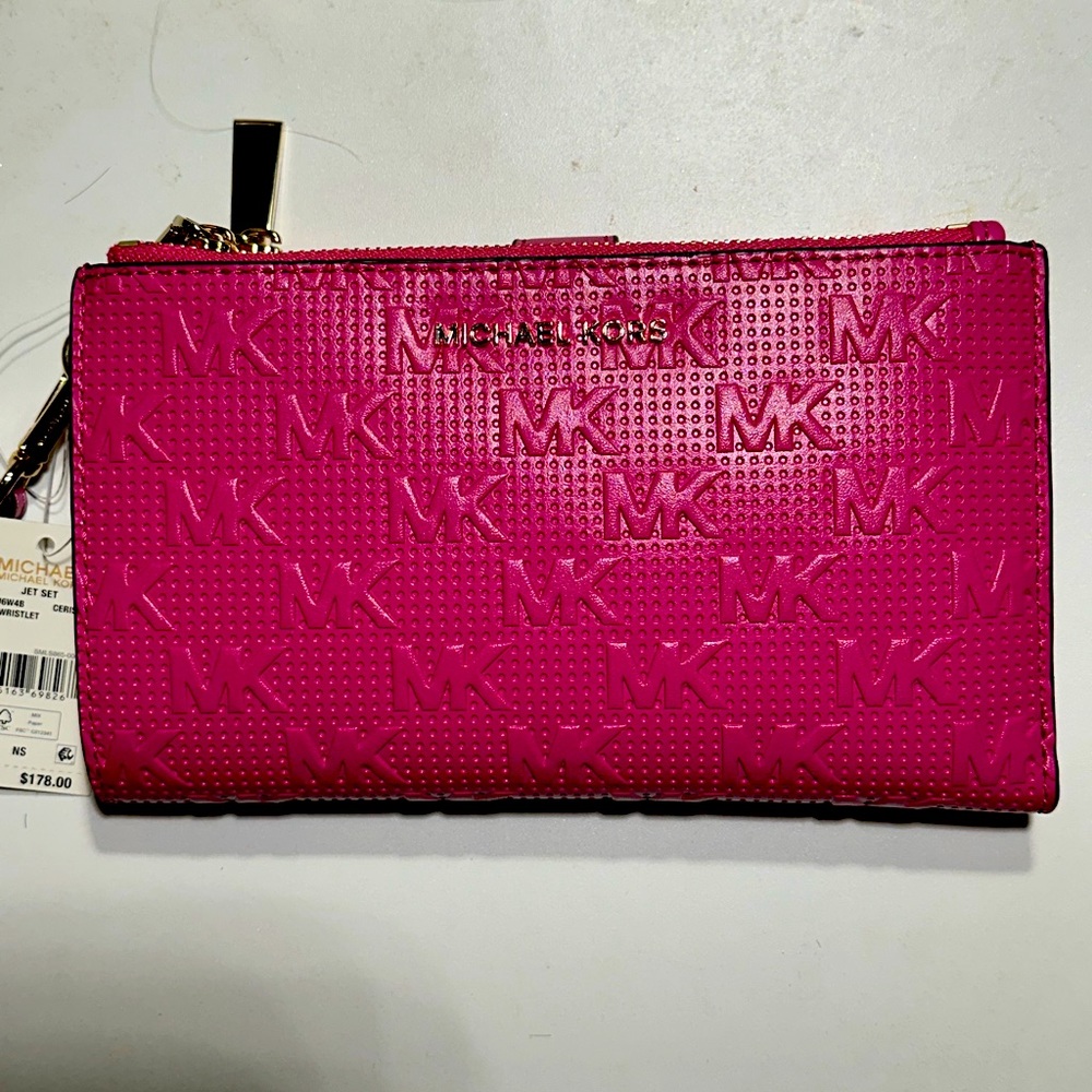 Women’s pink Michael Kors wristlet/wallet